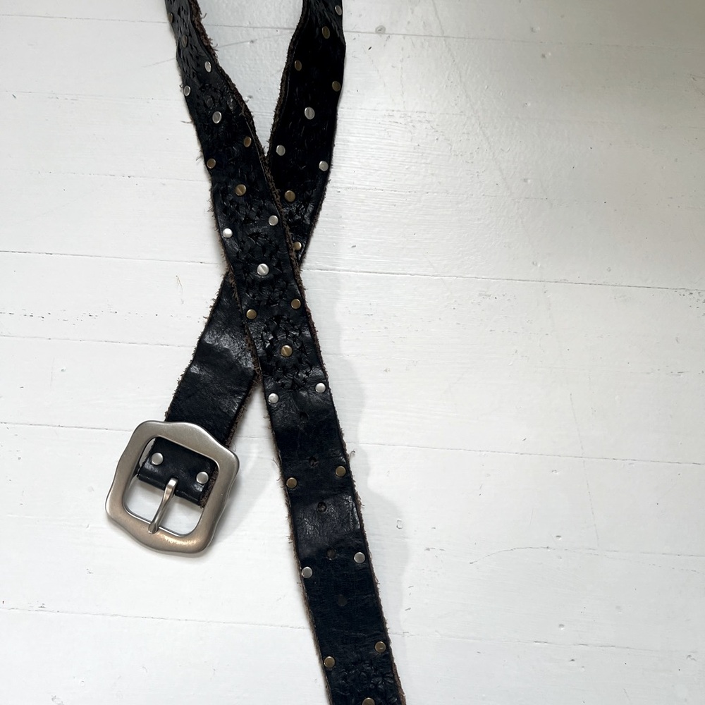 Lucky Black leather belt with scalloped leather, silver tone buckle.